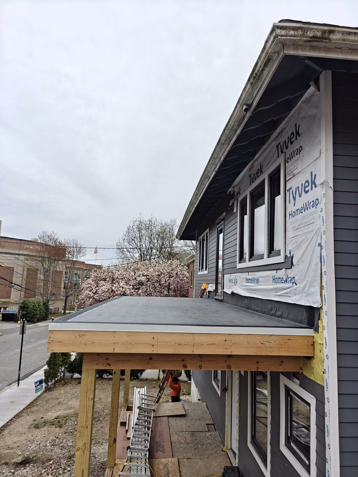 Flat roof membrane over a home addition during construction